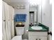 Well-maintained bathroom featuring sink, toilet, shower, and decorative anchor hooks at 115 N Loblolly Xing, Temple, GA 30179