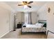 Bedroom featuring a window, stylish decor, neutral carpet, and black metal bed frame at 115 N Loblolly Xing, Temple, GA 30179