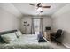 Bedroom features a ceiling fan, window and a desk with computer at 115 N Loblolly Xing, Temple, GA 30179