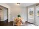 Charming dining area with wood table, wood and white chairs, wood floors, and natural light at 115 N Loblolly Xing, Temple, GA 30179