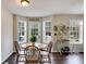 Bright dining area with wood floors, farmhouse decor, and lots of natural light at 115 N Loblolly Xing, Temple, GA 30179