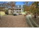 Charming home featuring a welcoming front porch, dormer windows, and neatly maintained landscaping at 115 N Loblolly Xing, Temple, GA 30179