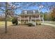 Charming home featuring a welcoming front porch, dormer windows, and neatly maintained landscaping at 115 N Loblolly Xing, Temple, GA 30179