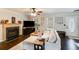 Comfortable living room features a stone fireplace, hardwood floors, and modern furniture at 115 N Loblolly Xing, Temple, GA 30179