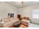 Cozy living room with plush seating, a coffee table, and a window for natural light at 115 N Loblolly Xing, Temple, GA 30179