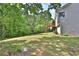 Expansive backyard with a gentle slope and lush green lawn at 4199 Wyndham Park Way, Buford, GA 30519