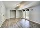 Finished basement with wood-look floors and French doors leading to the outside at 4199 Wyndham Park Way, Buford, GA 30519