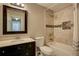 Updated bathroom featuring a tiled shower and bath alongside a sleek vanity with storage at 4199 Wyndham Park Way, Buford, GA 30519