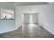 Open dining room with wood floors and view of the kitchen and backyard access at 4199 Wyndham Park Way, Buford, GA 30519