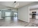 Open-concept living room flows into the kitchen, showcasing modern lighting and an open floor plan at 4199 Wyndham Park Way, Buford, GA 30519