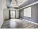 Spacious main bedroom features wood floors, tray ceiling, and abundant natural light at 4199 Wyndham Park Way, Buford, GA 30519