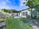 A lush backyard features a well-maintained lawn, garden, and patio at 132 Neese Farm Dr, Woodstock, GA 30188