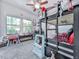 bedroom featuring a bunk bed, carpet, and natural light from a pair of windows at 132 Neese Farm Dr, Woodstock, GA 30188
