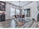 Cozy dining area with stylish lighting, large windows, and a sliding glass door at 132 Neese Farm Dr, Woodstock, GA 30188