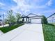 Inviting home featuring a paved driveway, two-car garage and beautifully landscaped yard at 132 Neese Farm Dr, Woodstock, GA 30188