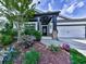 Charming home featuring a well-manicured lawn, stone accents, and inviting entrance at 132 Neese Farm Dr, Woodstock, GA 30188