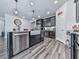Bright kitchen featuring an island, stainless steel appliances, and open layout at 132 Neese Farm Dr, Woodstock, GA 30188