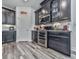 Well-equipped kitchen with stainless steel appliances and dark wood cabinets at 132 Neese Farm Dr, Woodstock, GA 30188