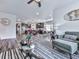 Open-concept living room showcasing stylish decor, modern furniture, hardwood floors, and a view into the kitchen at 132 Neese Farm Dr, Woodstock, GA 30188
