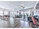 Spacious living room and dining area featuring hardwood floors, large windows, modern decor, and stylish furniture at 132 Neese Farm Dr, Woodstock, GA 30188