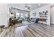 Bright living room with hardwood floors, large windows, stylish furniture, and modern decor at 132 Neese Farm Dr, Woodstock, GA 30188