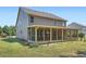 Large backyard with screened in porch at 23 Dynasty Dr, Fairburn, GA 30213