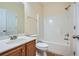 Cozy bathroom with tub and shower combo, vanity, and white toilet at 23 Dynasty Dr, Fairburn, GA 30213