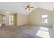Bedroom featuring carpet floors, many windows, a ceiling fan, and vaulted ceilings at 23 Dynasty Dr, Fairburn, GA 30213