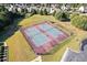 Aerial view of well-maintained tennis courts in a residential community, perfect for active homeowners at 23 Dynasty Dr, Fairburn, GA 30213
