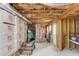Unfinished basement with exposed ceiling joists, stored boxes, and a walkout door at 1099 Mount Water Ln, Lawrenceville, GA 30043