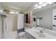 Bathroom featuring a vanity, framed mirror, and shower with tub and curtain at 1099 Mount Water Ln, Lawrenceville, GA 30043
