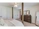 Bedroom with neutral carpet, a wooden four-poster bed, and a dresser for ample storage at 1099 Mount Water Ln, Lawrenceville, GA 30043