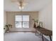 Bonus room with a ceiling fan, a view of the street, and a large table for Gathering fun at 1099 Mount Water Ln, Lawrenceville, GA 30043