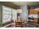 Inviting dining area featuring a wood table with seating and natural light from the window at 1099 Mount Water Ln, Lawrenceville, GA 30043