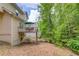 Exterior backyard view featuring a patio deck and an outdoor swing at 1099 Mount Water Ln, Lawrenceville, GA 30043