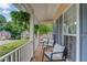 Relaxing front porch with comfortable seating, hanging plants, and a view of the neighborhood at 1099 Mount Water Ln, Lawrenceville, GA 30043