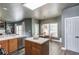Open kitchen layout that flows into the living and dining areas, featuring modern stainless appliances at 1099 Mount Water Ln, Lawrenceville, GA 30043