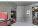 Spacious office with neutral walls, decorative elements, and a view to another room at 1099 Mount Water Ln, Lawrenceville, GA 30043