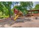 Community playground with slide, swings, benches, and picnic tables, providing a fun and safe environment for children at 1099 Mount Water Ln, Lawrenceville, GA 30043