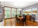 Elegant dining room with brick accent wall and large windows at 1868 Gordon Ne Mnr, Atlanta, GA 30307
