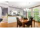 Open concept dining area next to the kitchen with hardwood floors, stainless appliances, and natural light at 1868 Gordon Ne Mnr, Atlanta, GA 30307