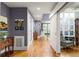 Elegant hallway boasts hardwood floors, stylish furnishings, and leads to a bright, inviting living space at 1868 Gordon Ne Mnr, Atlanta, GA 30307