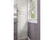 Bright kitchen pantry with white cabinets and a view from the window at 1868 Gordon Ne Mnr, Atlanta, GA 30307