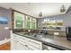 Well-lit kitchen with granite countertops and stainless steel appliances at 1868 Gordon Ne Mnr, Atlanta, GA 30307