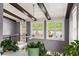 Bright landing with a ceiling fan and multiple windows overlooking the outdoor patio area at 1868 Gordon Ne Mnr, Atlanta, GA 30307