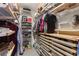 Organized walk-in closet with shelves, drawers, and hanging rods to maximize storage space at 1868 Gordon Ne Mnr, Atlanta, GA 30307