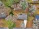 Aerial view of a charming residence with a well-kept roof surrounded by lush trees and lawn at 2588 Shady Sw Ln, Conyers, GA 30094
