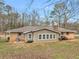 The backyard boasts a quaint house, a grill, and plenty of open space at 2588 Shady Sw Ln, Conyers, GA 30094