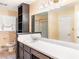 Bathroom featuring a large mirror, vanity with storage, and window with natural light at 2588 Shady Sw Ln, Conyers, GA 30094