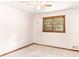 Bedroom with neutral walls, carpet flooring, and a window with natural light at 2588 Shady Sw Ln, Conyers, GA 30094